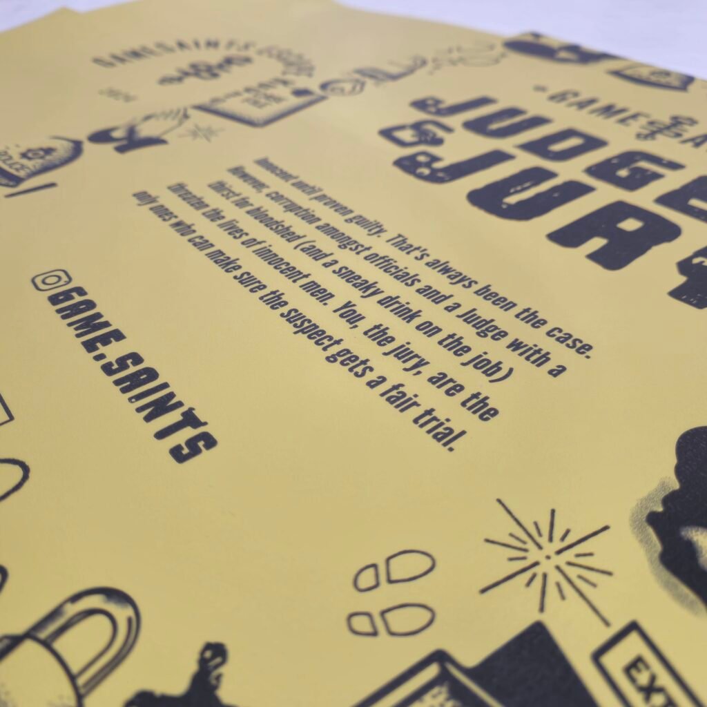 Close-up of a yellow poster with large bold black text and small icons along the bottom, text is partially blurred but layout suggests a flyer or poster design.